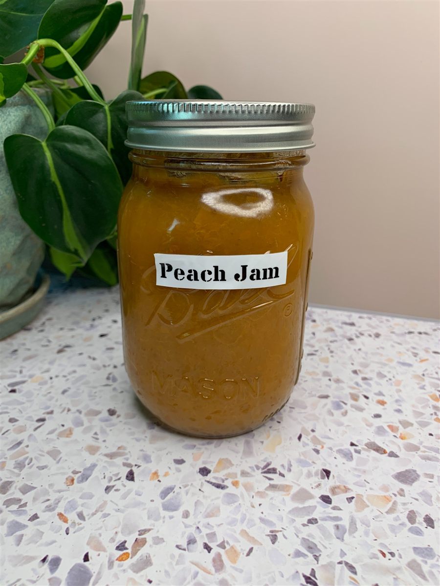 Jars of homemade peach jam.