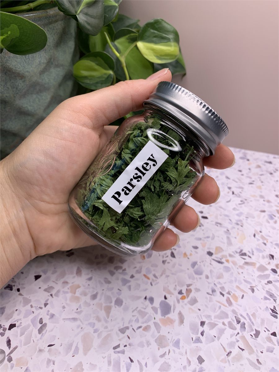 A jar of dried parsley.